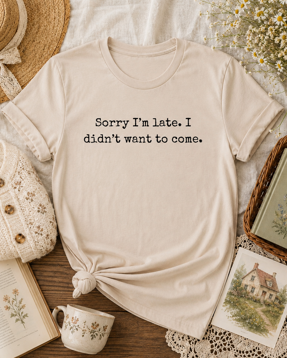 A cream-colored short-sleeve t-shirt with the text 'Sorry I'm late. I didn't want to come.